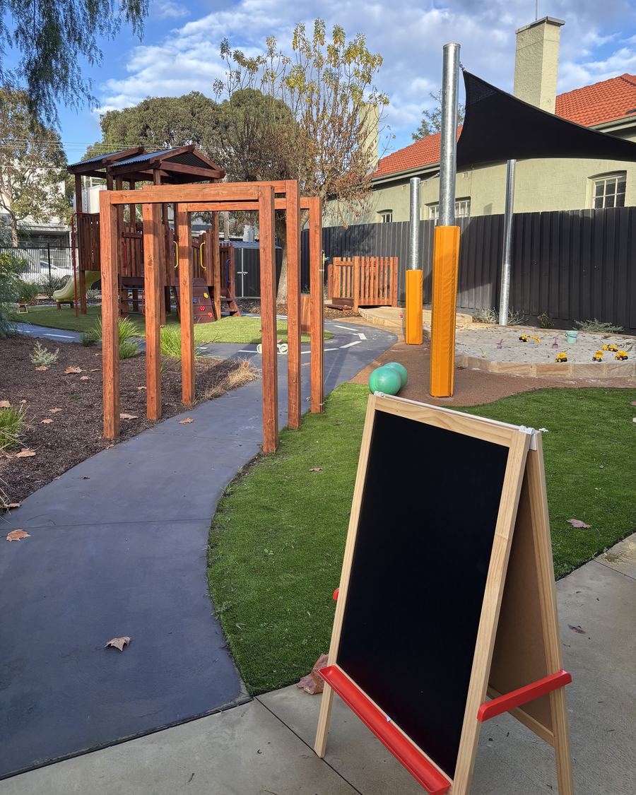 An outdoor easel beside the bike path
